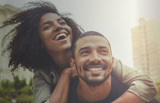 woman in glasses drinking from a mug